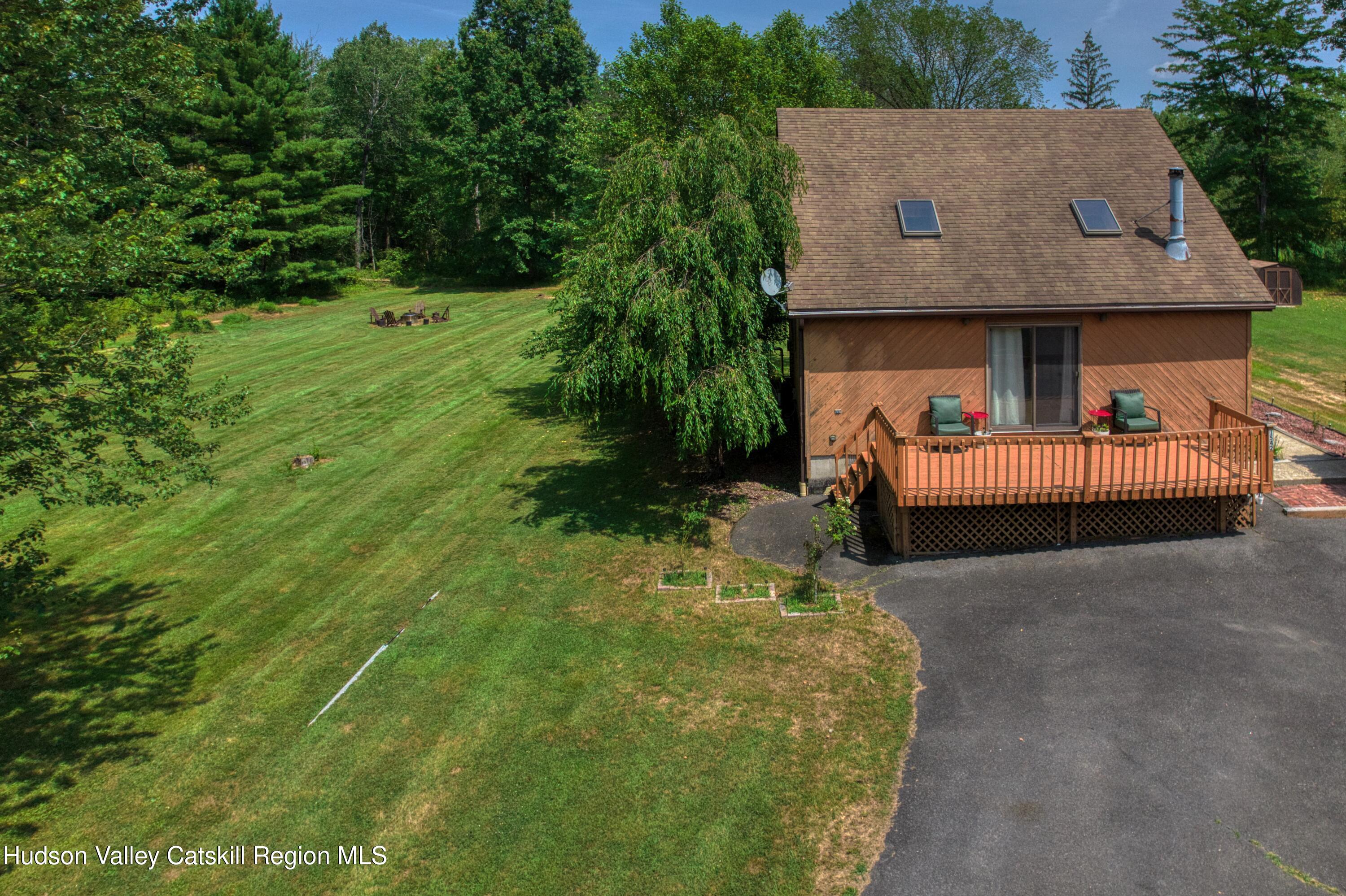 1542 Sleepy Hollow Road Athens, NY 12015 - Photo 22 of 27 a backyard of a house with lots of green space
