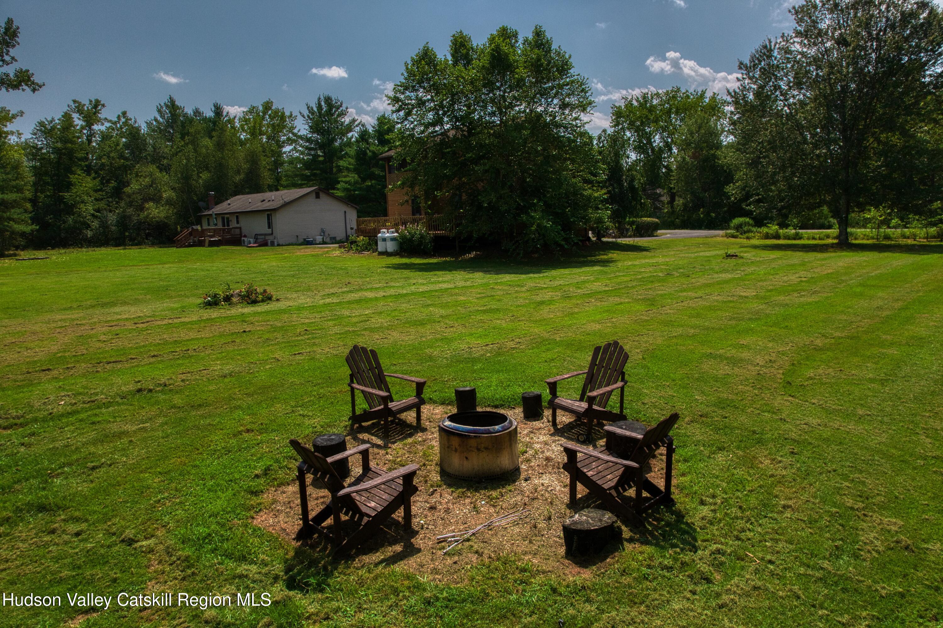 1542 Sleepy Hollow Road Athens, NY 12015 - Photo 5 of 27 a view of a table and chairs in the garden