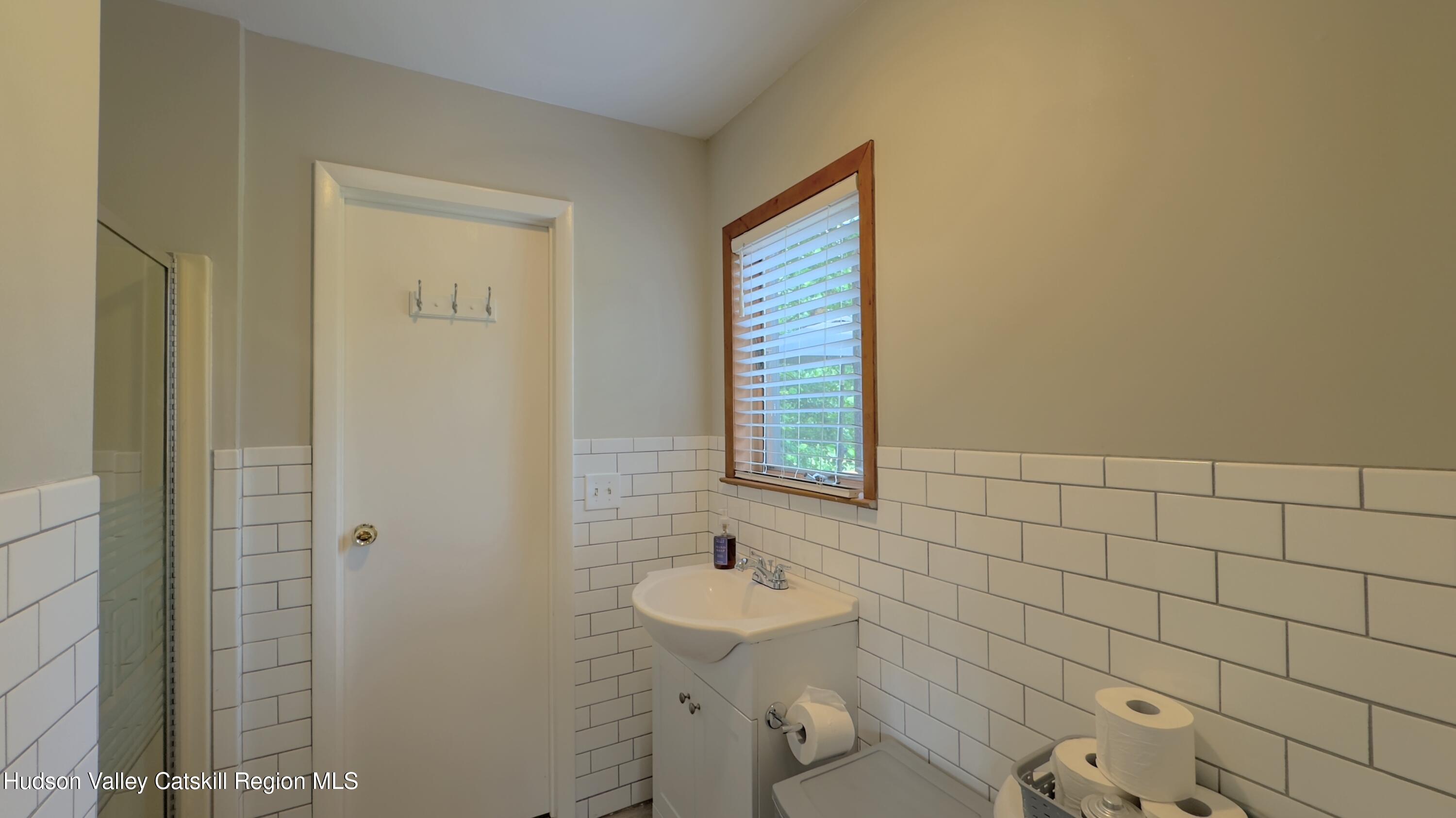 1542 Sleepy Hollow Road Athens, NY 12015 - Photo 8 of 27 a bathroom with a sink a toilet and mirror