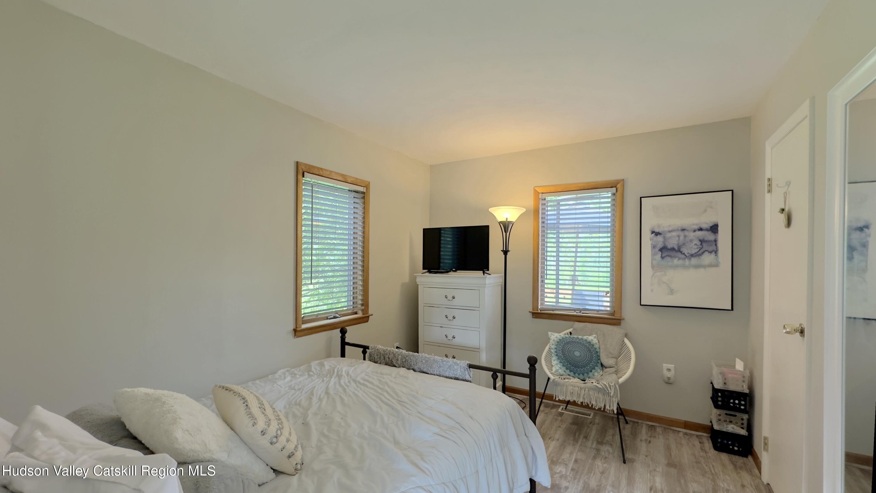 1542 Sleepy Hollow Road Athens, NY 12015 - Photo 10 of 27 a bedroom with a bed and a tv