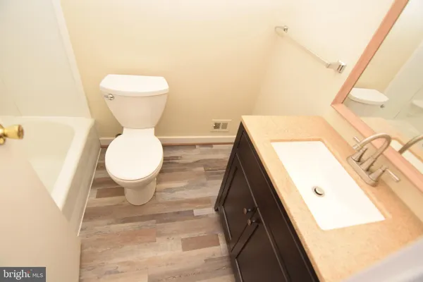 a view of bathroom with a toilet and a sink