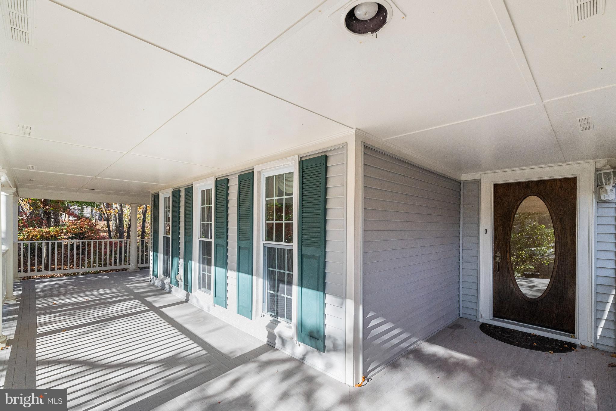 Covered Porch that wraps front of Home