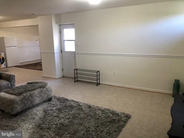 a view of livingroom with furniture and window