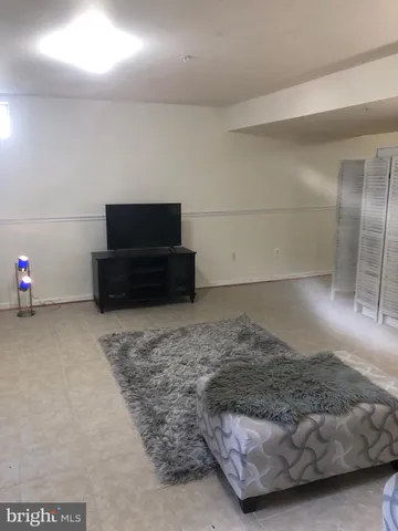 a living room with a couch and a flat screen tv