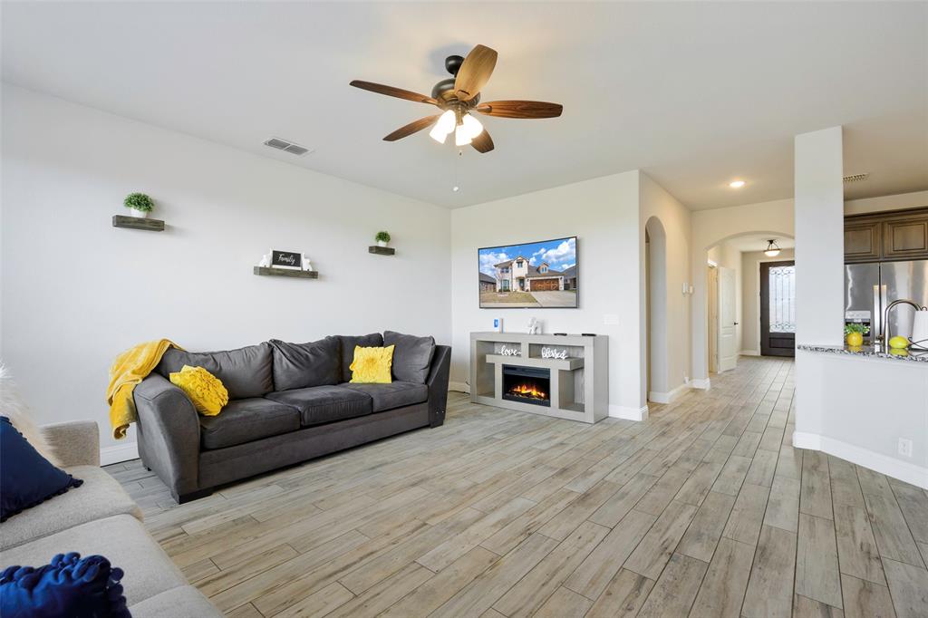 4059 Three Forks Road Kaufman, TX 75142 - Photo 9 of 25 a living room with furniture and a fireplace