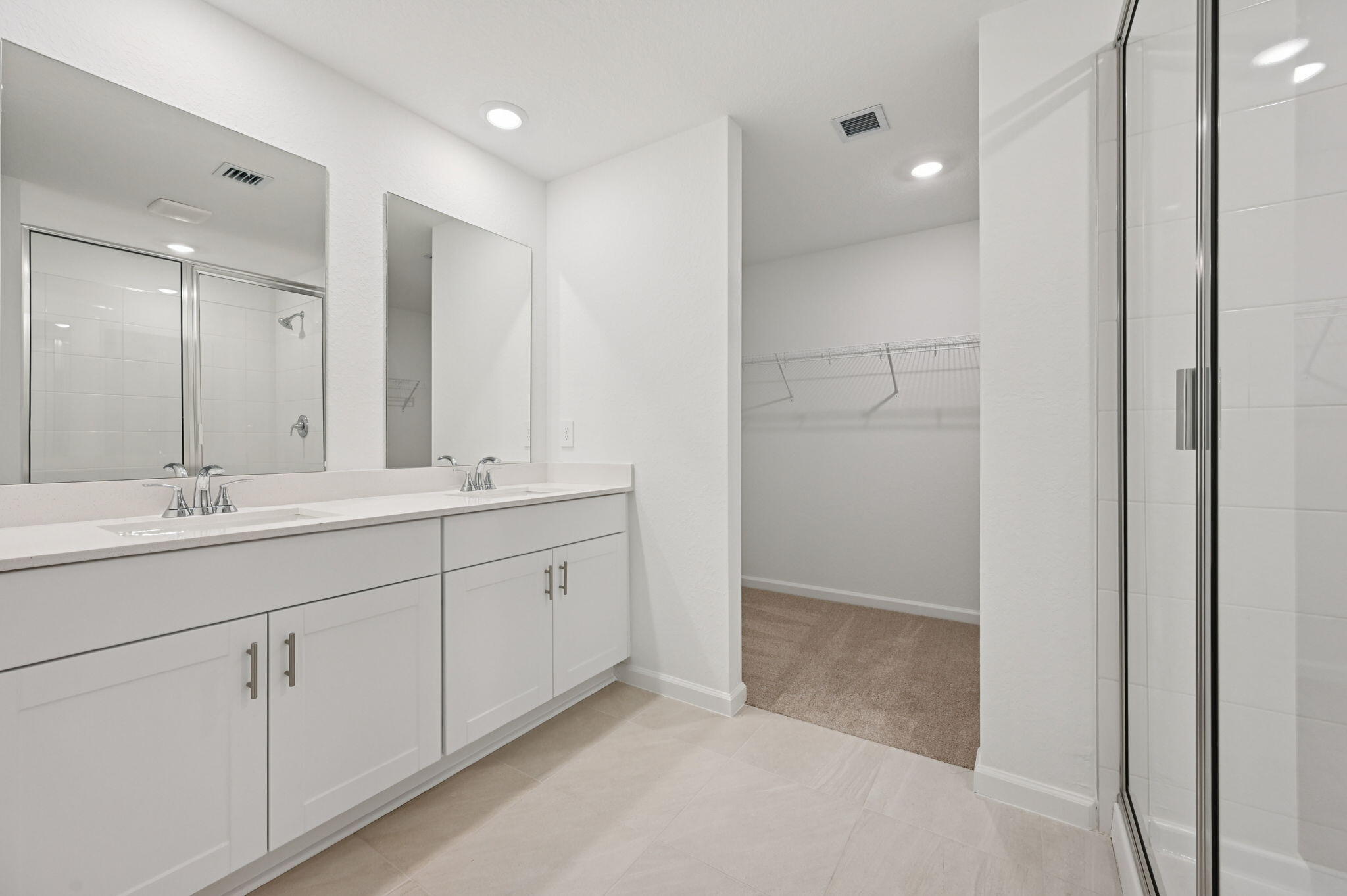 14202 Southwest New Dawn Road Indiantown, FL 34956 - Photo 18 of 27 a bathroom with a double vanity sink and a mirror