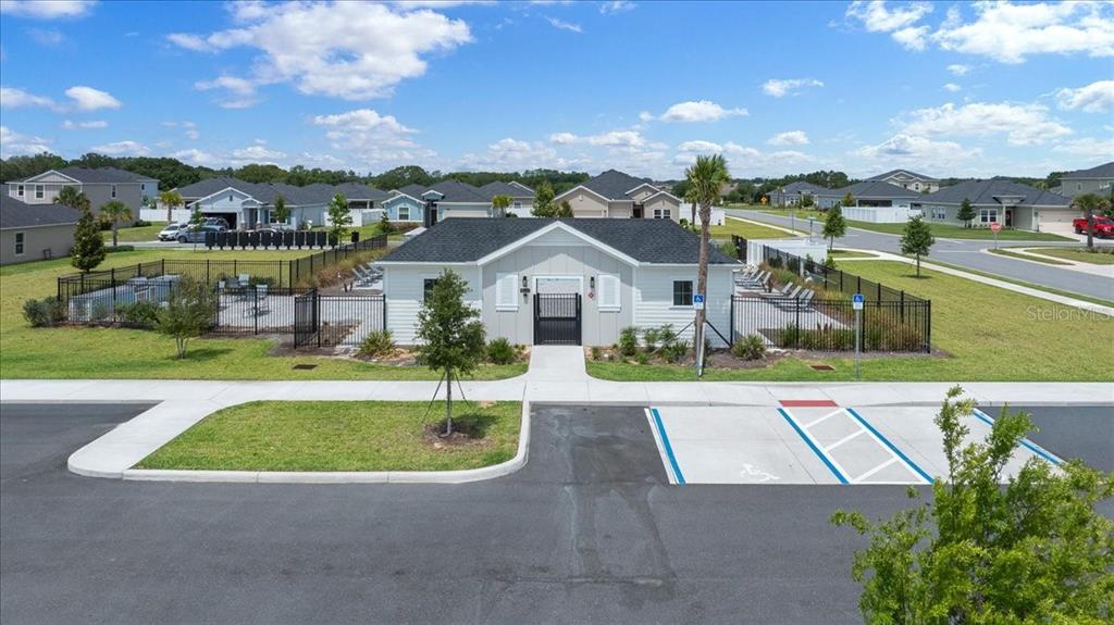 9329 Southwest 57th Terrace Ocala, FL 34476 - Photo 48 of 64 a view of house with a garden and swimming pool