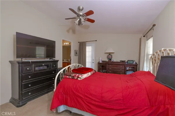 a bed room with a bed and a chandelier