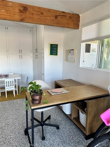 a view of a patio with a table and chairs