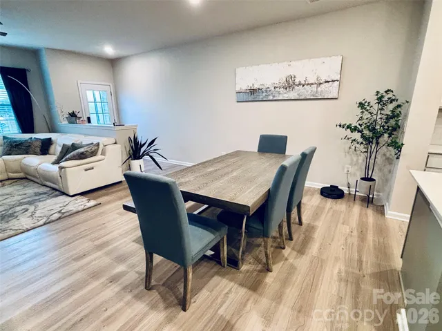 a bathroom with a sink a toilet a mirror and shower