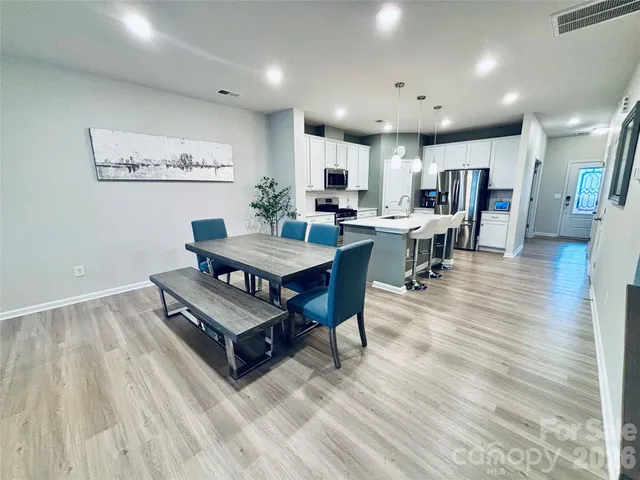 a bedroom with furniture and a fireplace