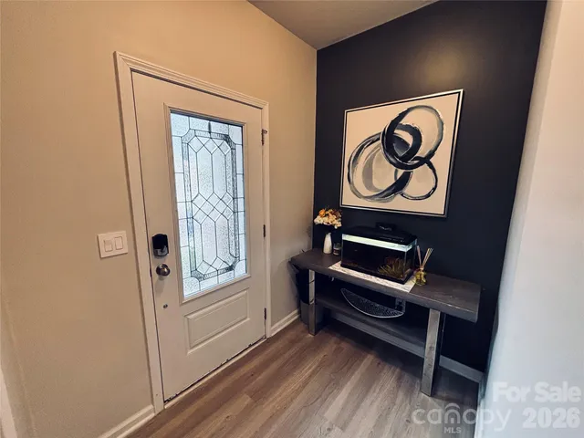 a kitchen with a sink stove top oven and refrigerator