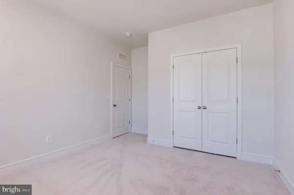 a bathroom with a shower and a toilet
