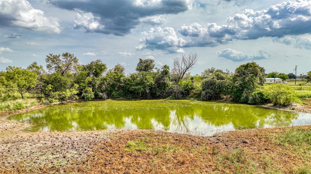 11500 Bowden Road Lipan, TX 76462 - Photo 6 of 32 a view of a swimming pool with an outdoor space and seating area