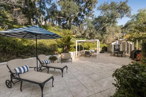 a view of a chairs and table in the patio