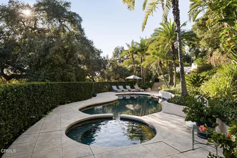 a view of a swimming pool with a yard