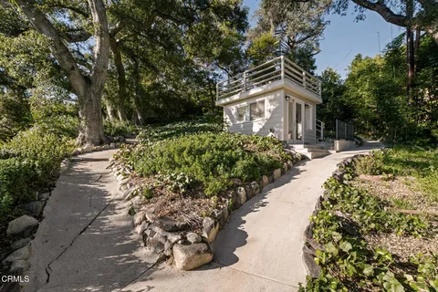 a view of a pathway with a yard