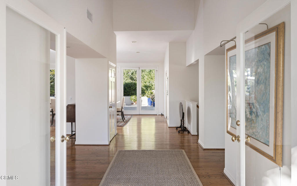 1460 Virginia Road San Marino, CA 91108 - Photo 3 of 27 a view of a hallway with wooden floor and a bathroom