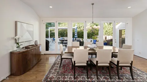 a view of a dining room with furniture window and outside view