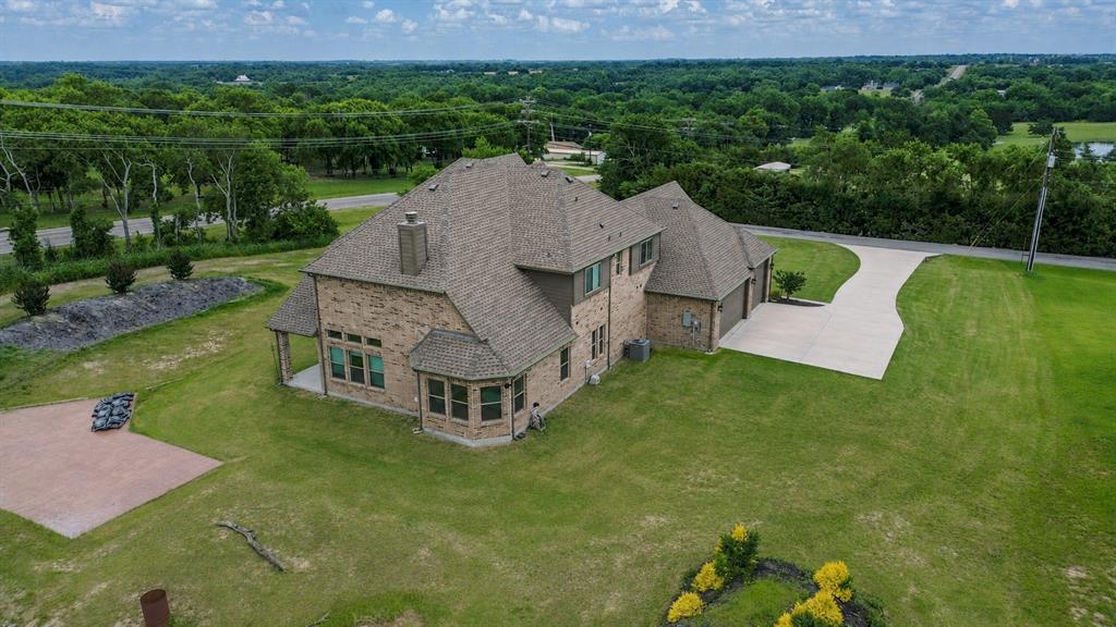25 Morrison Road Howe, TX 75459 - Photo 25 of 27 Expansive property featuring a brick-clad residence with a multi-level roofline