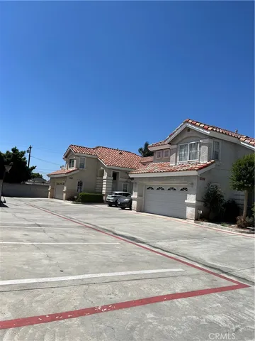 a view of a blue house with yard