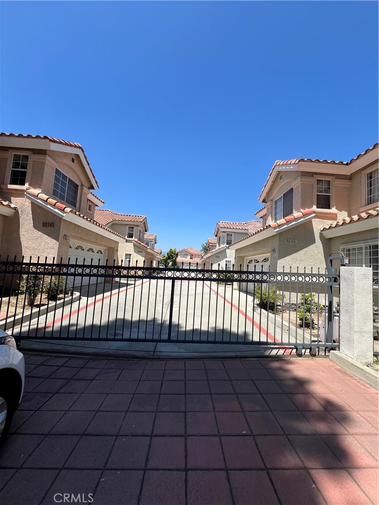 12143 Ferris Road El Monte, CA 91732 - Photo 18 of 18 a front view of a house with a garden