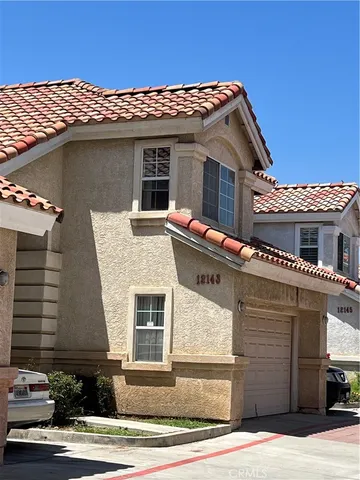 a front view of a house with garage