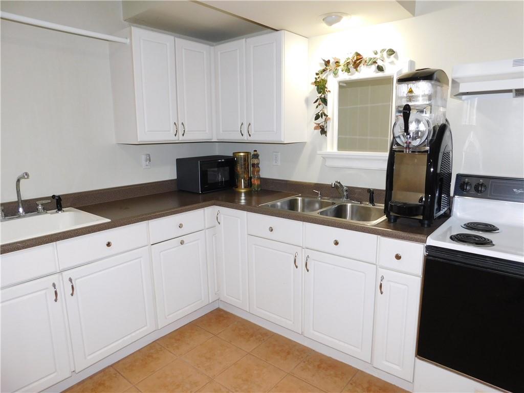 195 Finnin Road Lower Burrell, PA 15068 - Photo 17 of 21 a kitchen with granite countertop white cabinets and white appliances