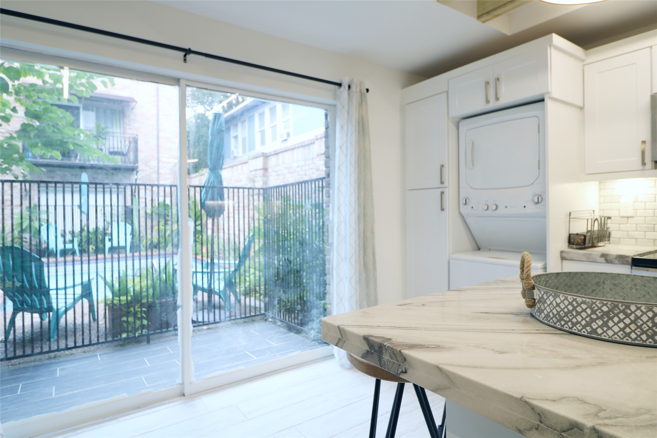 412 Pacific Street, Unit 2G Houston, TX 77006 - Photo 13 of 14 a bedroom with a bed and a large window