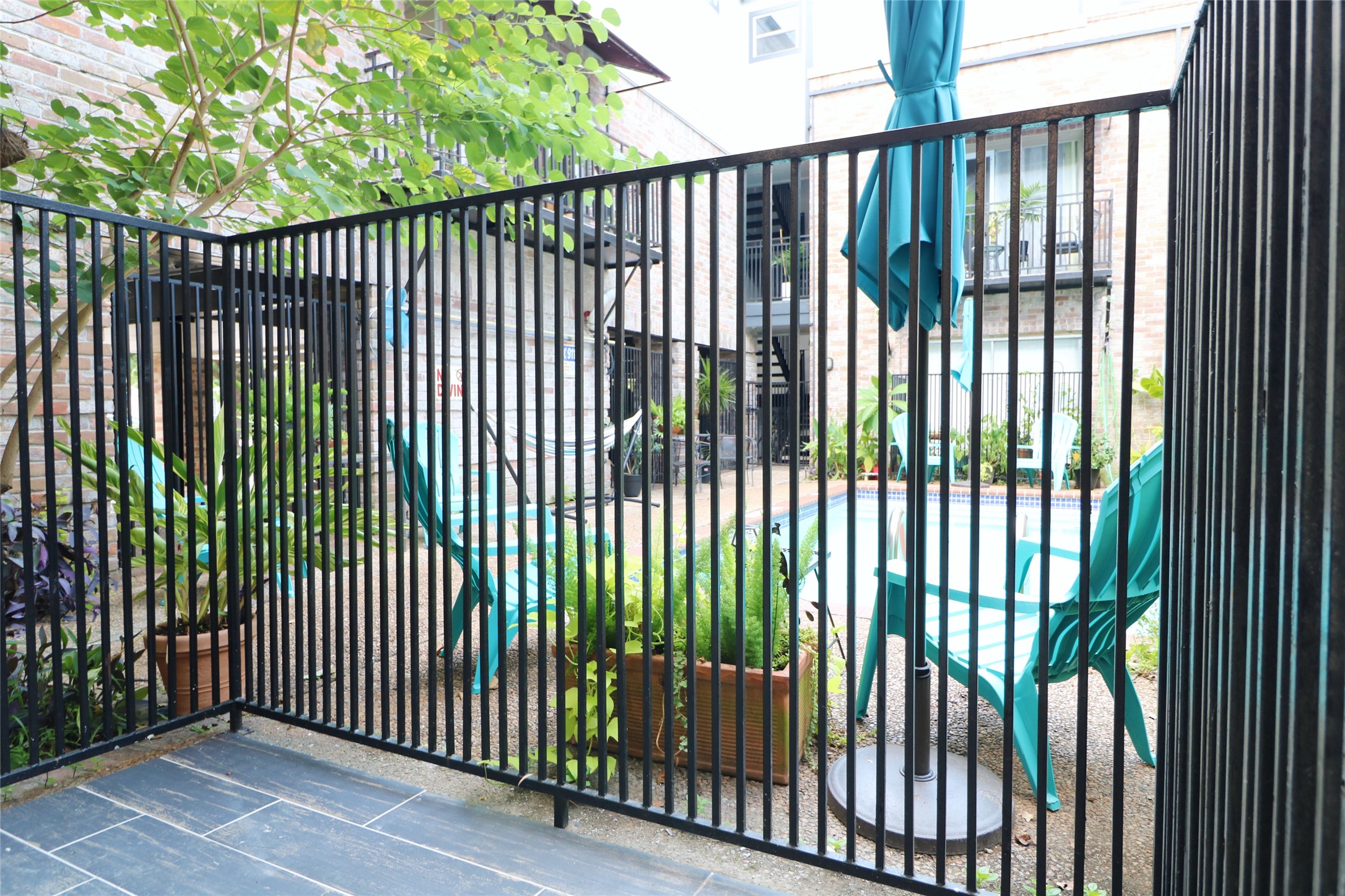 412 Pacific Street, Unit 2G Houston, TX 77006 - Photo 3 of 14 a view of a black gate