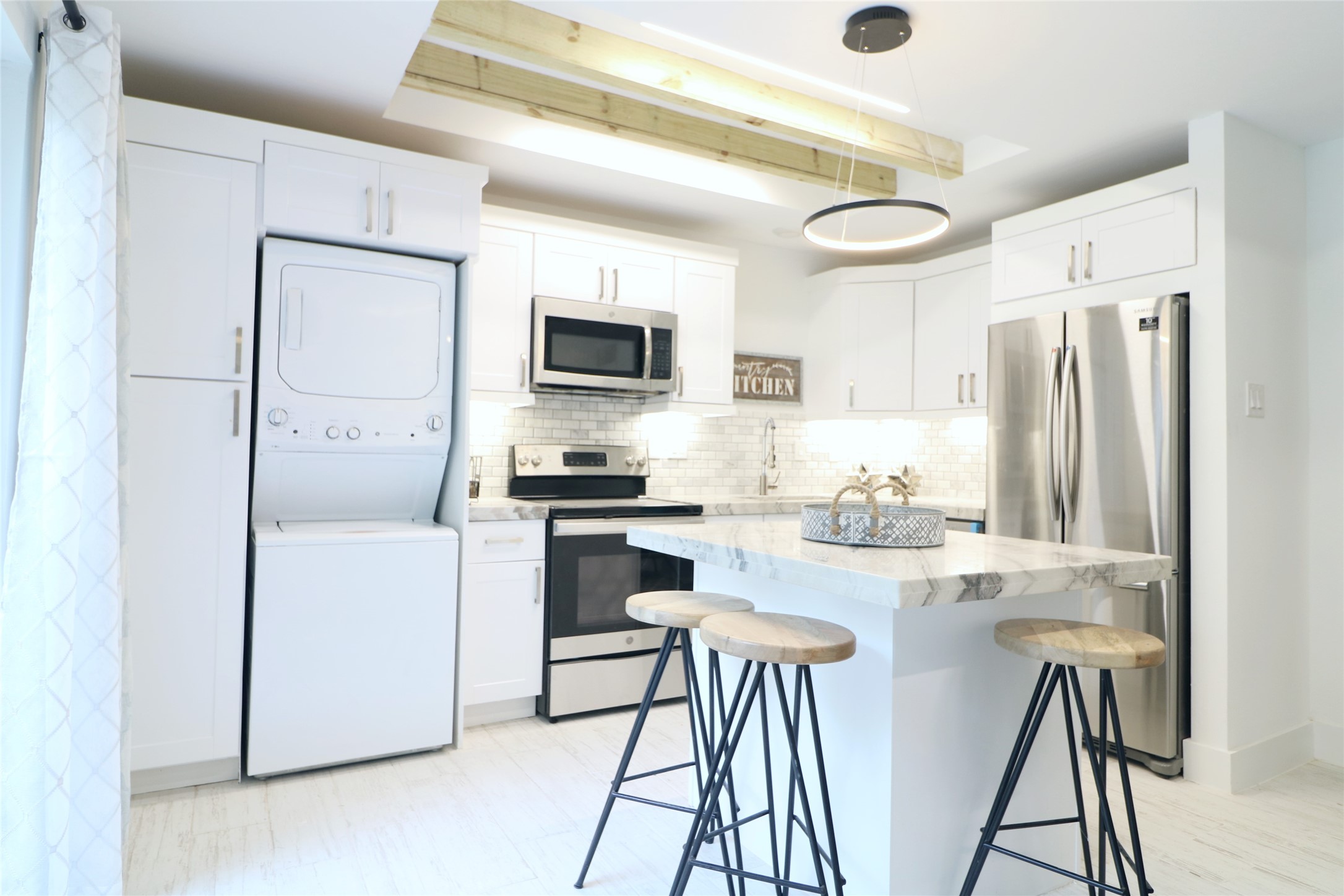 412 Pacific Street, Unit 2G Houston, TX 77006 - Photo 5 of 14 a kitchen with stainless steel appliances a refrigerator and a stove top oven