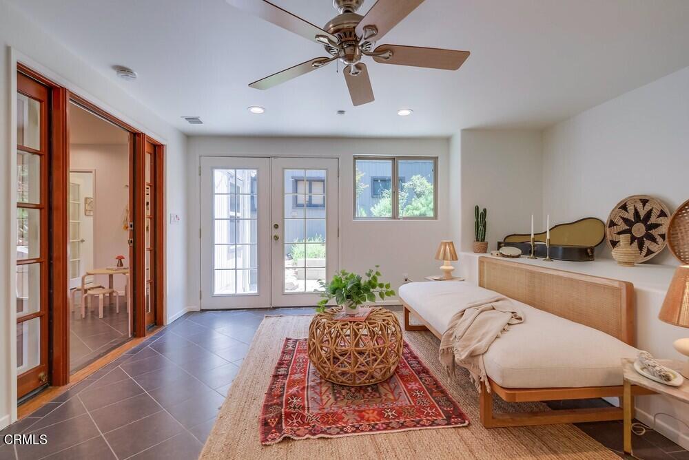 6287 Pine Crest Drive Los Angeles, CA 90042 - Photo 54 of 64 a spacious bedroom with a large bed and a chandelier