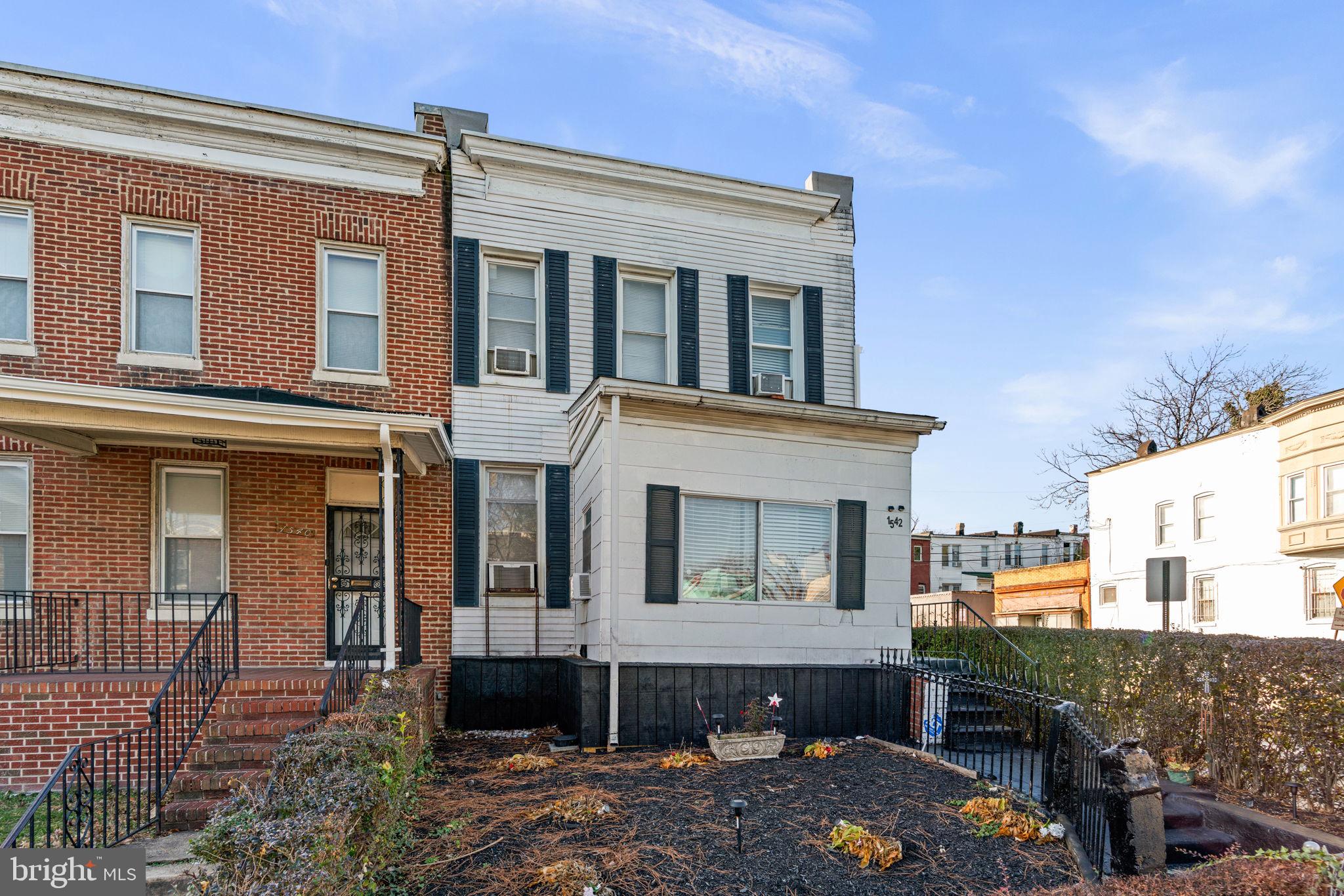 1542 Appleton Street Baltimore, MD 21217 - Photo 3 of 12 a front view of a house with balcony