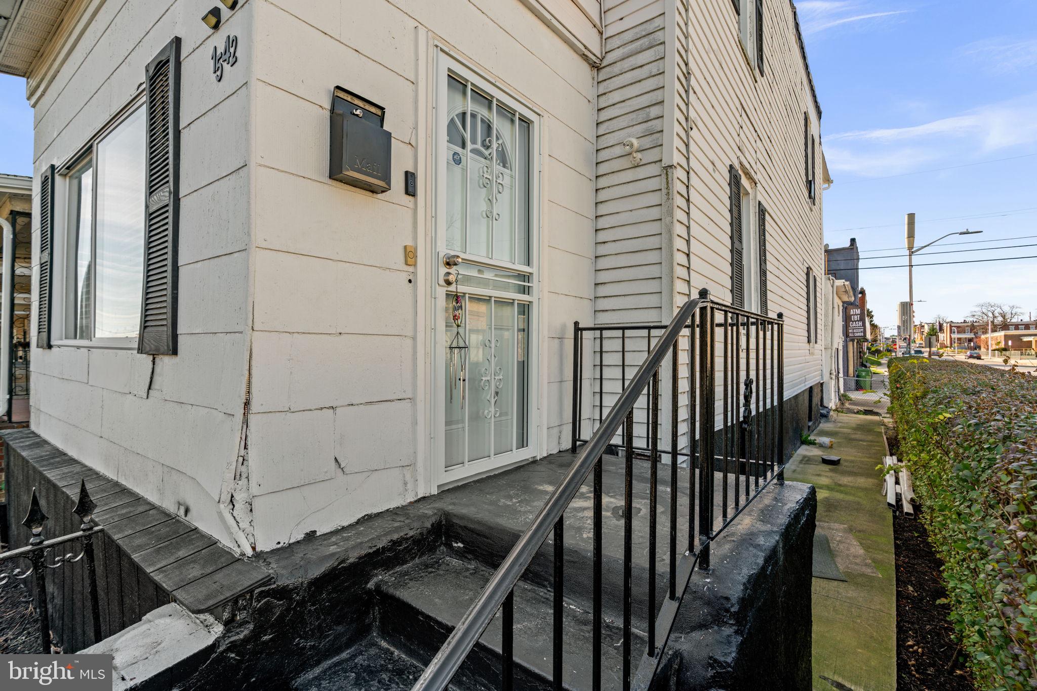 1542 Appleton Street Baltimore, MD 21217 - Photo 4 of 12 a view of a balcony with wooden floor and fence