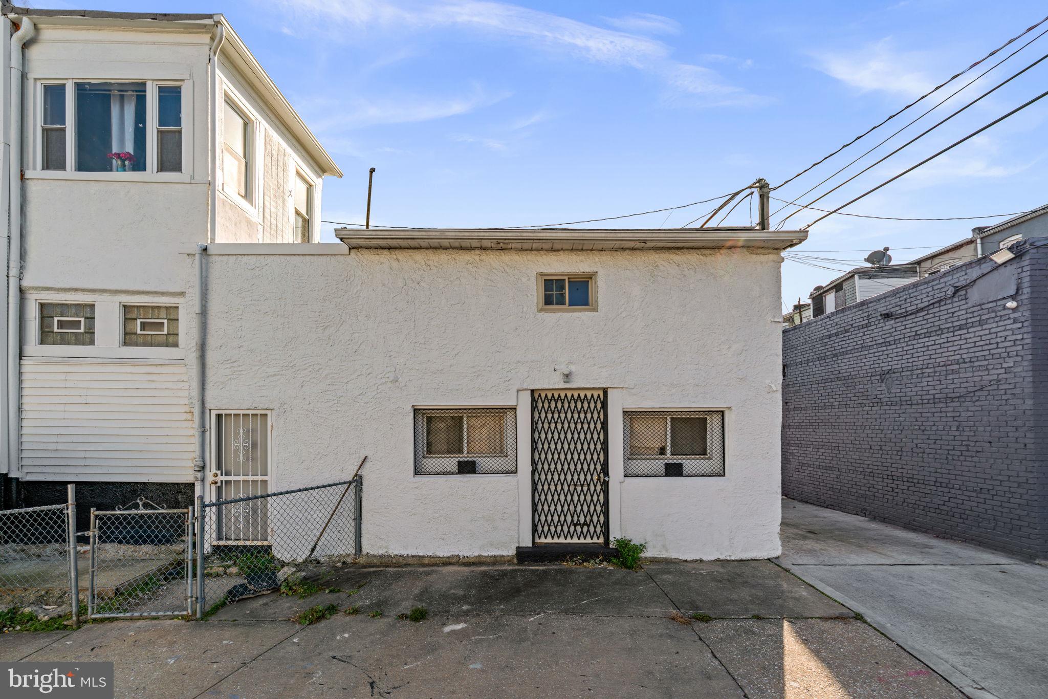 1542 Appleton Street Baltimore, MD 21217 - Photo 6 of 12 a view of a house with street