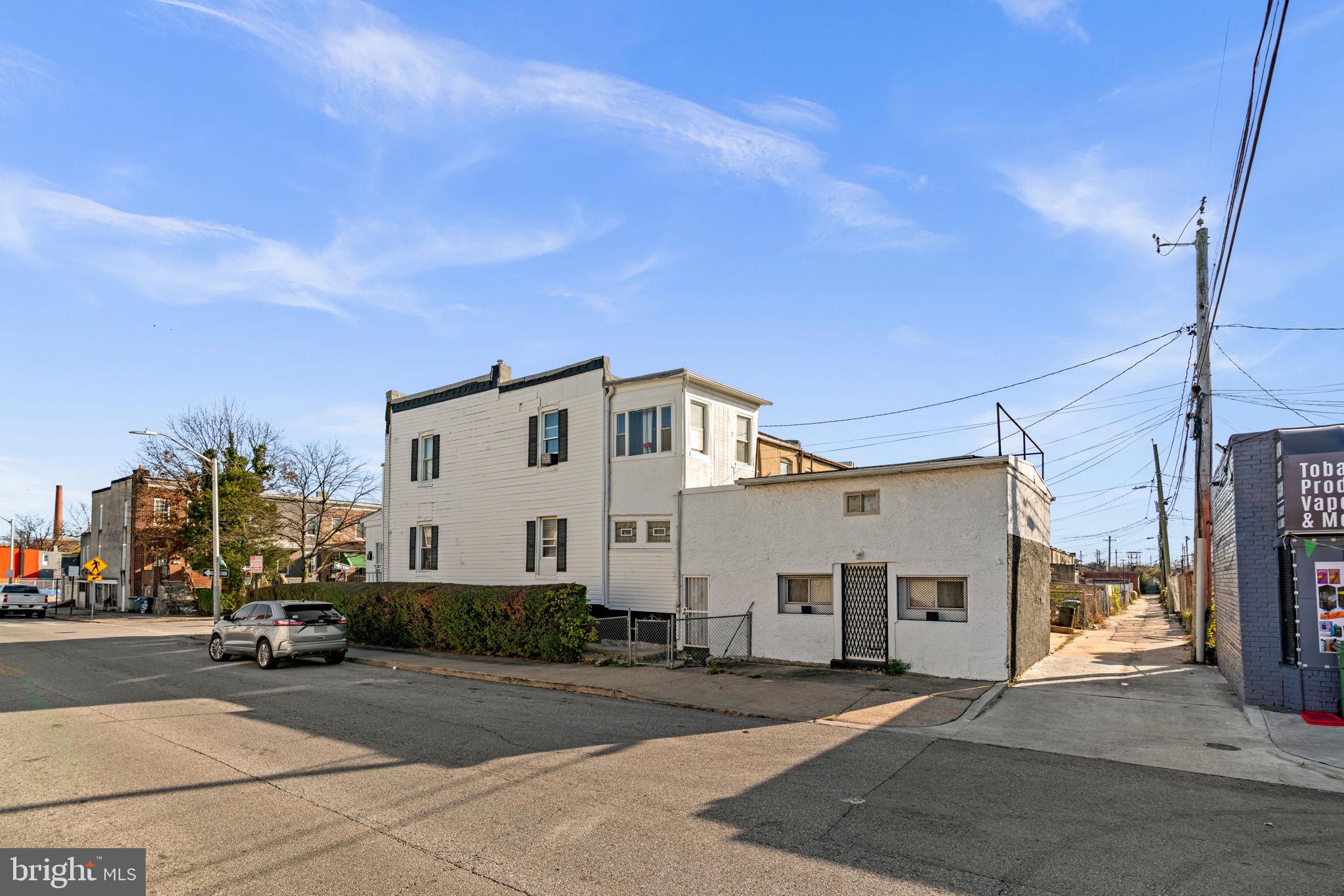 1542 Appleton Street Baltimore, MD 21217 - Photo 8 of 12 a view of a house with a street