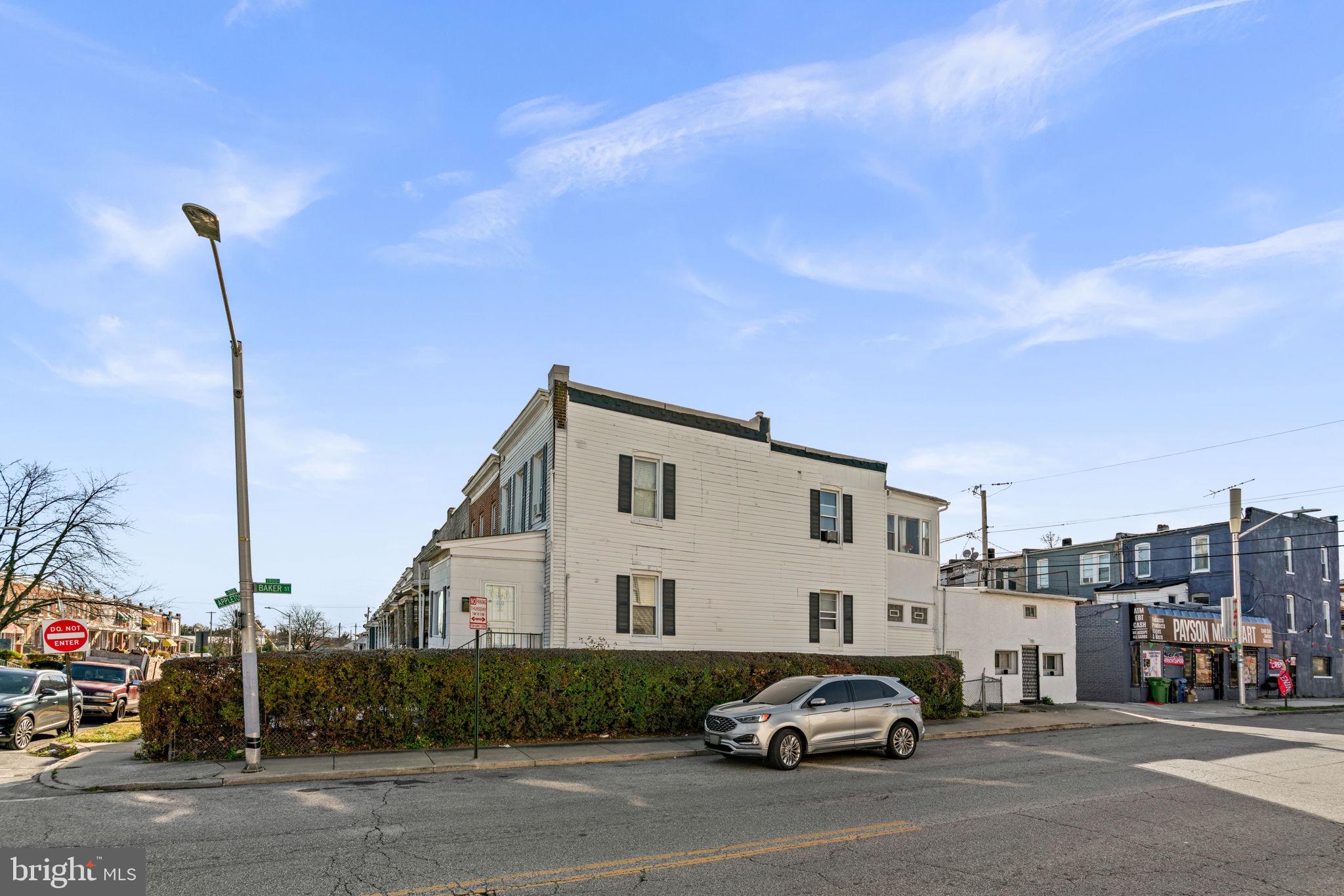 1542 Appleton Street Baltimore, MD 21217 - Photo 9 of 12 a view of car parked in front of house