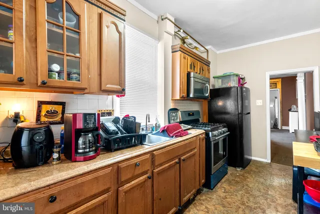 a children room with furniture and a fan