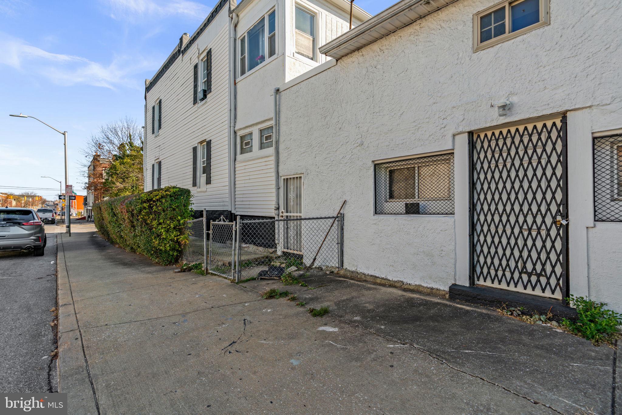 1542 Appleton Street Baltimore, MD 21217 - Photo 10 of 12 a view of a house with many windows