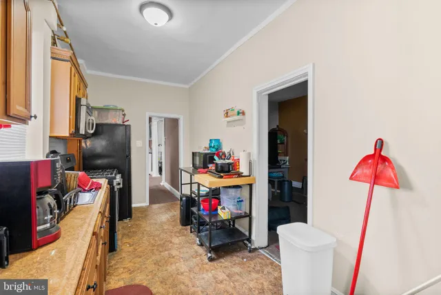 a pathway of a house with a yard