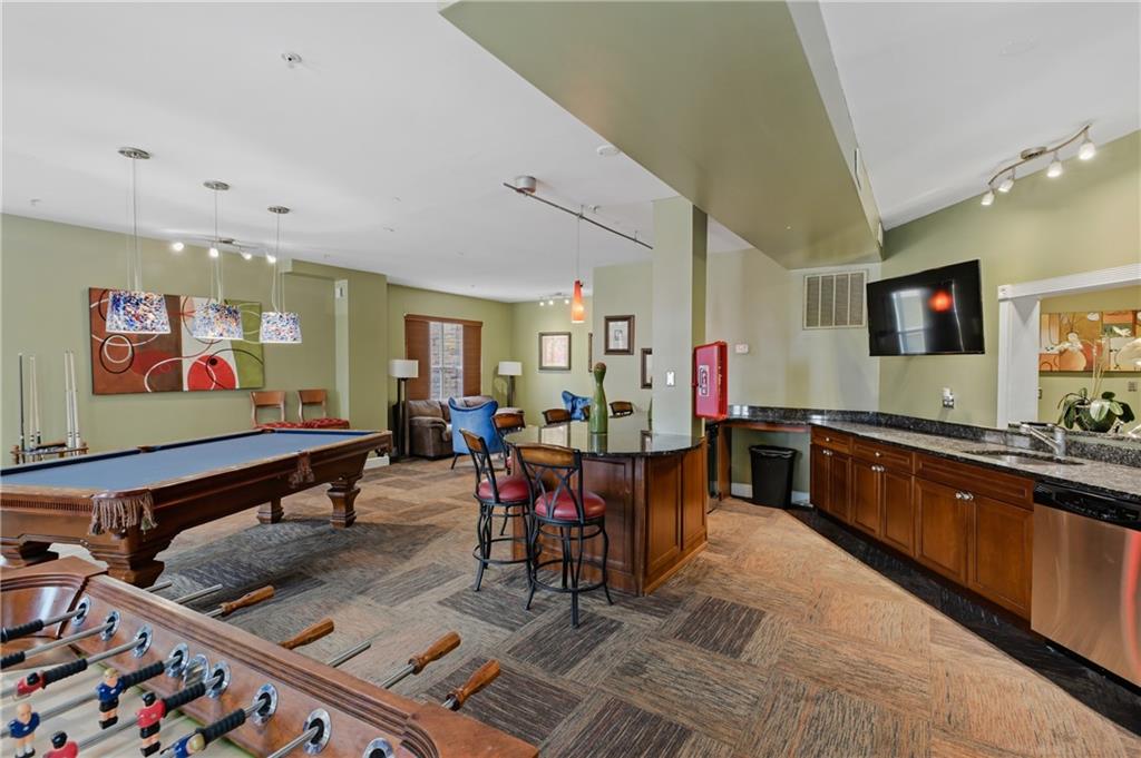 10 Perimeter Summit Boulevard, Unit 3311 Atlanta, GA 30319 - Photo 21 of 68 a living room with lots of furniture and painting on the wall