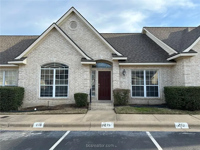 front view of a house and a yard