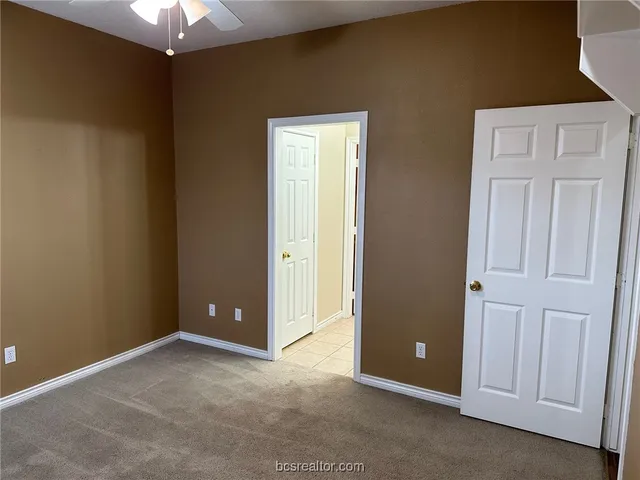 an empty room with closet area