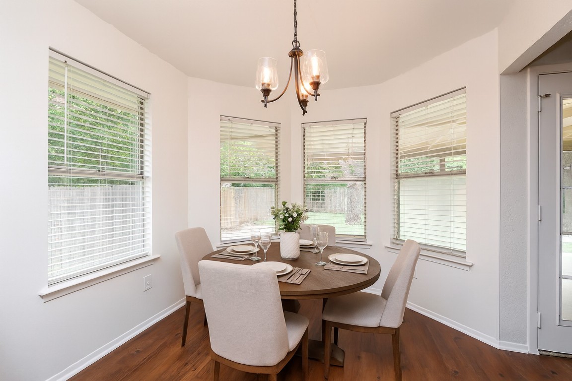 910 Garden View Drive Georgetown, TX 78628 - Photo 13 of 28 a view of a dining room with furniture window and wooden floor