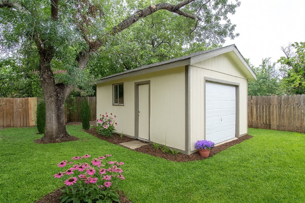 910 Garden View Drive Georgetown, TX 78628 - Photo 2 of 28 a view of a house with a yard and garage
