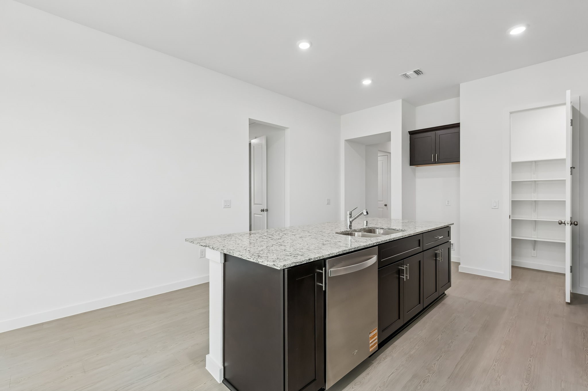 6703 Alejandro Place Cove, TX 77523 - Photo 6 of 30 a kitchen with a sink and cabinets