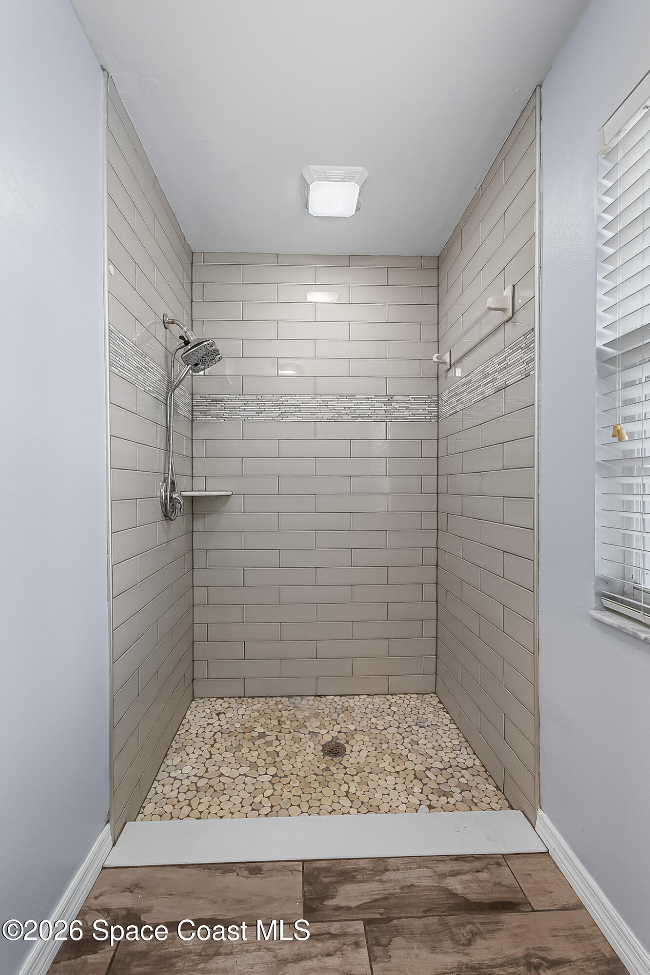 865 Dewberry Terrace Northeast Palm Bay, FL 32905 - Photo 11 of 29 a bathroom with a shower