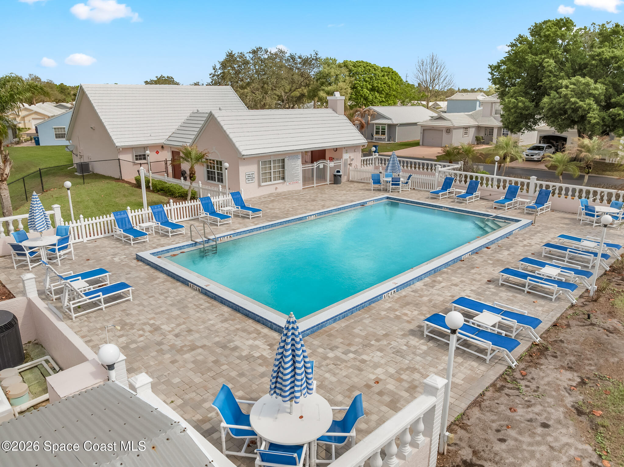 865 Dewberry Terrace Northeast Palm Bay, FL 32905 - Photo 23 of 29 a view of a patio with swimming pool table and chairs