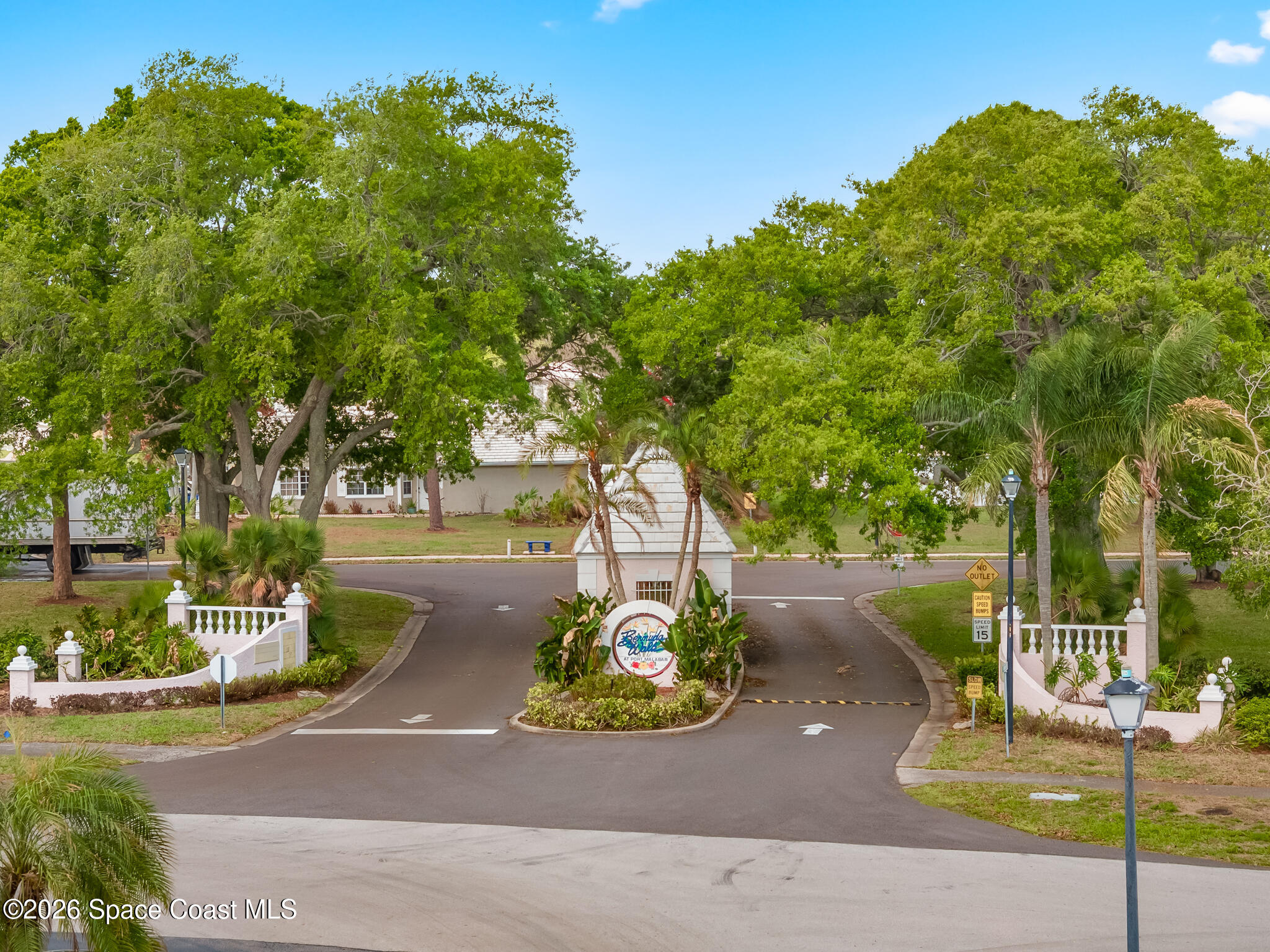 865 Dewberry Terrace Northeast Palm Bay, FL 32905 - Photo 27 of 29 a view of a park with plants and a large tree
