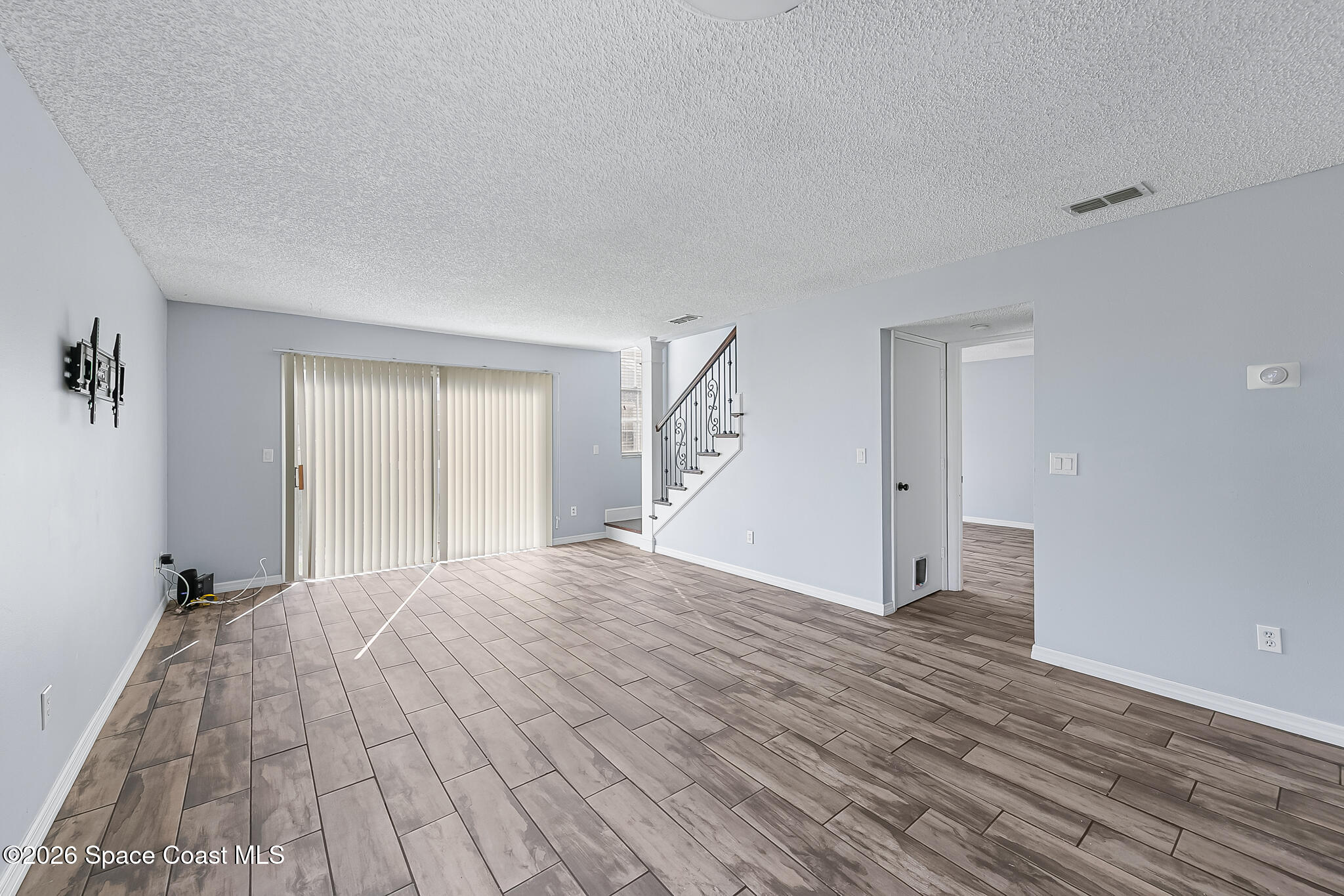 865 Dewberry Terrace Northeast Palm Bay, FL 32905 - Photo 28 of 29 a view of empty room with wooden floor